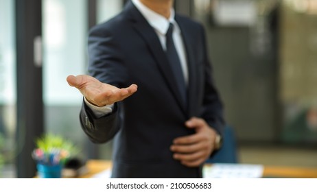 Businessman Stretch Hand For Handshake Greeting His Partners In The Meeting. Male CEO Hand Welcome Newcomer.