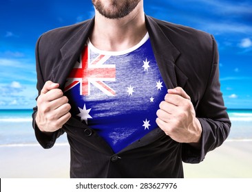 Businessman stretching suit with Australia Flag on beach background - Powered by Shutterstock