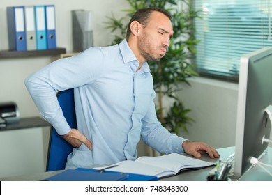 Businessman Suffering From Back Ache