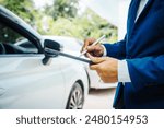 businessman in suit and car auto insurance agent assess car damage, discussing deductible, claims, coverage options comprehensive and collision insurance, completing necessary forms and appraisals.