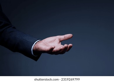 businessman in suit hand gesture with open palm - Powered by Shutterstock