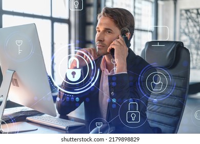Businessman in suit has conference call of cyber security in compliance division to protect clients confidential information. IT hologram lock icons over office background with panoramic windows. - Shutterstock ID 2179898829