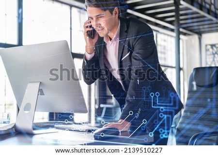 Businessman in suit has conference call to optimize development by implying new technologies in business process. Interconnections and hi tech hologram over office background with panoramic windows