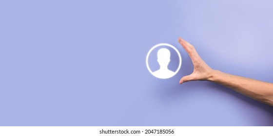 Businessman in suit holding out hand icon of user. Internet icons interface foreground. global network media concept,contact on virtual screens ,copy space. - Shutterstock ID 2047185056
