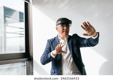 A businessman in a suit interacts with a VR headset, experiencing augmented reality in a professional workspace. - Powered by Shutterstock