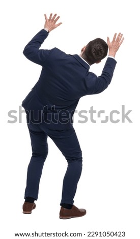 Businessman in suit on white background, back view