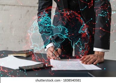 Businessman in suit signs contract. Double exposure with world map hologram. Man signing agreement international business concept.