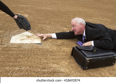 Businessman In Suit And Tie With A Briefcase Trying To Slide Into Home Plate With A Glove Waiting To Tag Him Out As An Analogy To Winning The Game