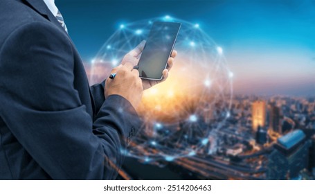 A businessman in a suit uses a stylus on a smartphone against a backdrop of a city skyline with a glowing network overlay. - Powered by Shutterstock