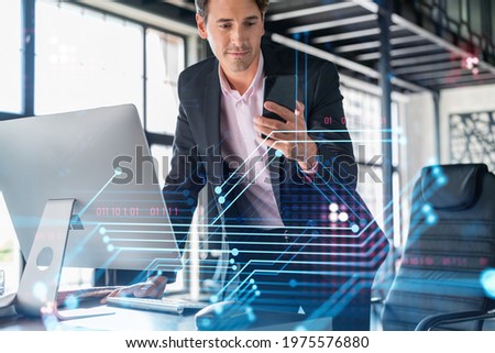 Businessman in suit using smart phone to optimize development by implying new technologies in business process. Interconnections and hi tech hologram over modern panoramic office background.