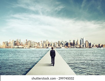 businessman in suit walking on concrete bridg to city - Powered by Shutterstock