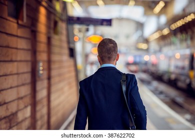 Businessman In Suit Walking At The Staition, Back View