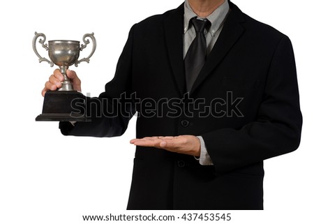 businessman  in suit ware hold trophy show his winner isolated on white background