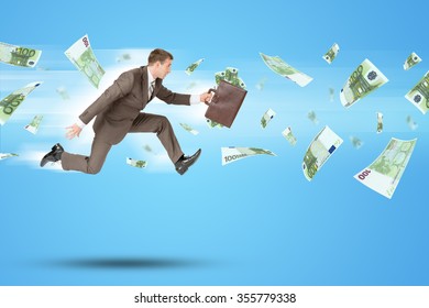 Businessman With Suitcase  Running Forward With Flying Money