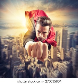 Businessman superhero flies faster in the sky - Powered by Shutterstock