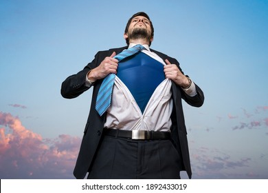 Businessman As Superhero Opening His Shirt.