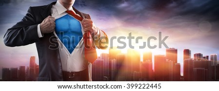 Businessman Superhero With Sunset In City
