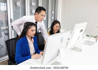 businessman supervisor training and suggesting about work to colleagues at call center service - Shutterstock ID 2031148769