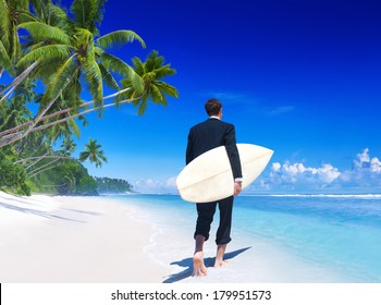 Businessman With Surfboard On Tropical Beach - Powered by Shutterstock