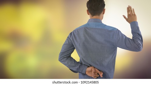 Businessman swearing honesty with hand and fingers crossed in nature - Powered by Shutterstock