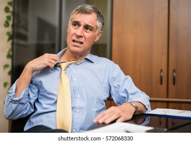 Businessman sweating in his office