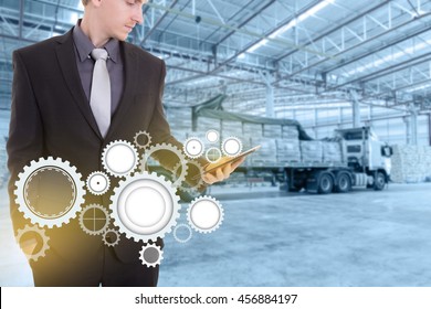 Businessman With Tablet On Hand , Concept Supply Chain Management Logistics Import Export Product At Large Warehouse.