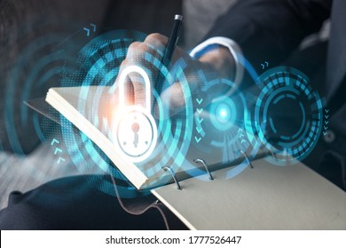 Businessman takes notes. Lock. Security concept. - Shutterstock ID 1777526447