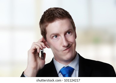 Businessman Taking A Call And He's Looks Like He Not Sure About Something