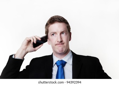 Businessman Taking A Call And He's Looks Like He Not Sure About Something