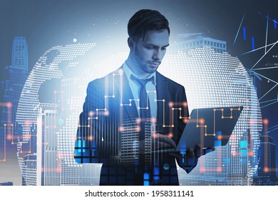 Businessman Taking Notes Into Laptop And Pondering About Future Perspectives. Financial Downtown City View On Background. Concept Of International Market. Worldwide Globe And Tech Interface.