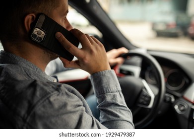 Businessman Talking On Cell Phone While Driving And Overtaking, Not Paying Attention To The Road And Traffic