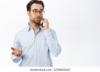 Businessman talking on mobile phone. Male entrepreneur calling someone, having a business call, standing over white background. - Powered by Shutterstock