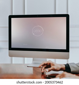 Businessman tapping his finger in front of a computer mockup