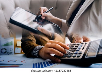 Businessman And Team Analyzing Financial Statement Finance Task. With Smart Phone And Laptop And Tablet. Wealth Management Concept
