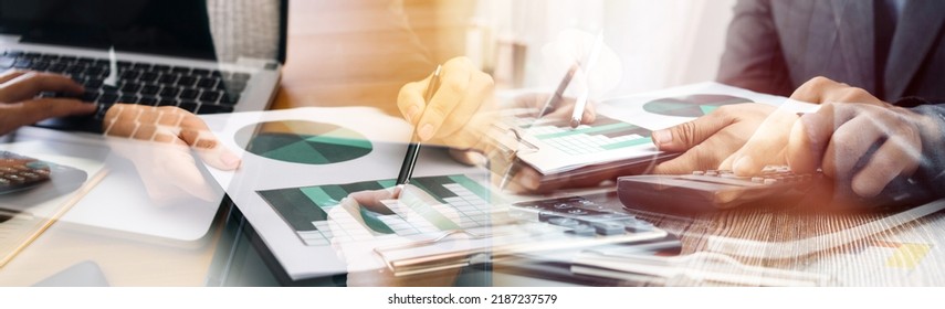 Businessman and team analyzing financial statement Finance task. with smart phone and laptop and tablet. Wealth management concept - Shutterstock ID 2187237579
