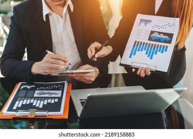 Businessman and team analyzing financial statement Finance task. with laptop and  tablet. Wealth management concept - Shutterstock ID 2189158883