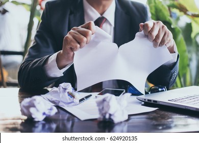 businessman tearing contract