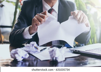 Businessman tearing contract