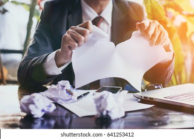 Businessman Tearing Contract