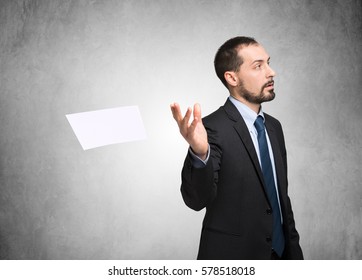 Businessman Throwing Away A Document