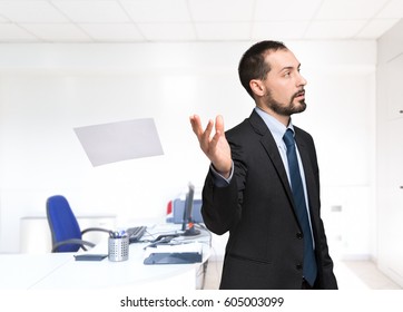 Businessman Throwing Away A Paper Sheet In His Office