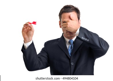 Businessman Throwing Dart On White