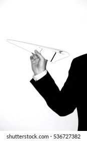 Businessman Throwing Paper Airplane