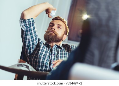 Businessman Throwing Paper In Trash Basket