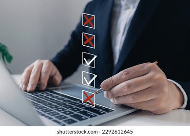Businessman tick X mark to rejected document checklist icon.check problem solution management with quality assurance or QA and quality control or QC and improvement, Standardization and certification.