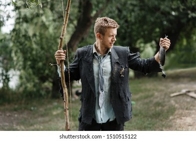 Businessman In Torn Suit Catch Fish On Lost Island