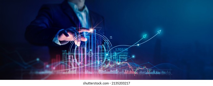 Businessman touch growth graph and progress of business and analyzing financial and investment data ,business planning and strategy on city background. - Shutterstock ID 2135203217