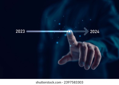 Businessman touch on virtual bar status to change from 2023 to 2024, countdown of merry Christmas and happy new year by technology concept, start new business and new life. New year's start-up.