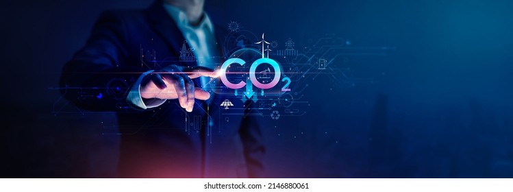 Businessman touch reduce CO2 emissions carbon Dioxide to Limit Global Warming and Climate Change and business of Renewable Energy on Clean and friendly environment with Sustainable development