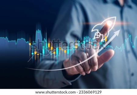 Businessman touch rocket launch investment growth, planning and starting corporate business start up aiming objective value development leadership and customer target group.
